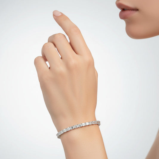 Diamond emerald cut tennis bracelet with white gold
