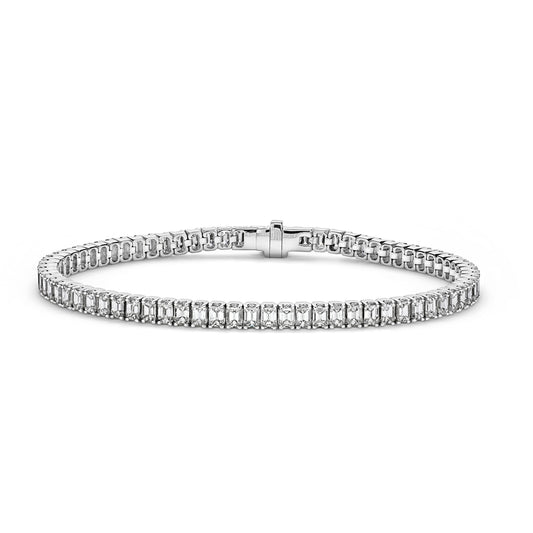 Diamond emerald cut tennis bracelet in white gld