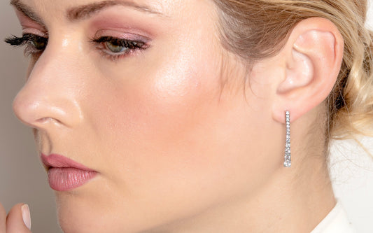 model wearing drop diamond earring