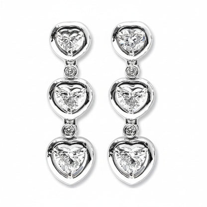 A pair of heart-shaped diamonds drop earrings made with white gold, featuring multiple heart brilliants.