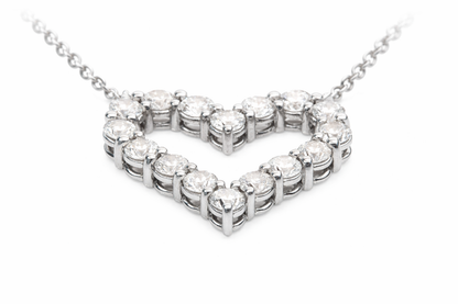 Diamond necklace with a heart-shaped design on a white background