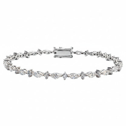 A tennis bracelet featuring marquise and round diamond shapes, set in a white gold band,